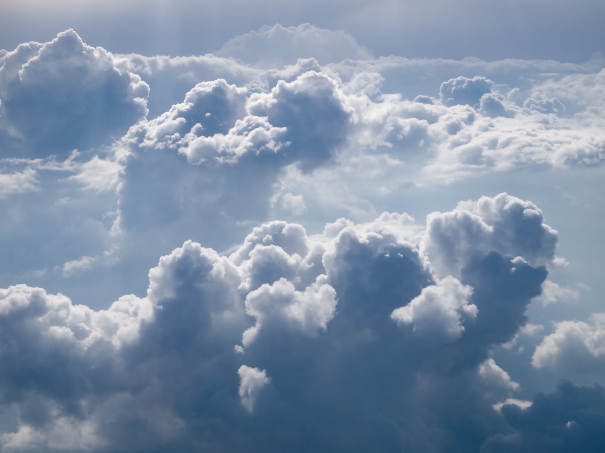 Close-up view of puffy white clouds filling the sky