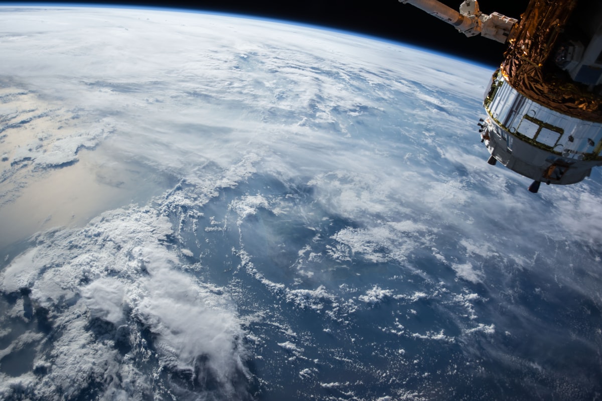 Earth seen from space, oceans and clouds against the darkness